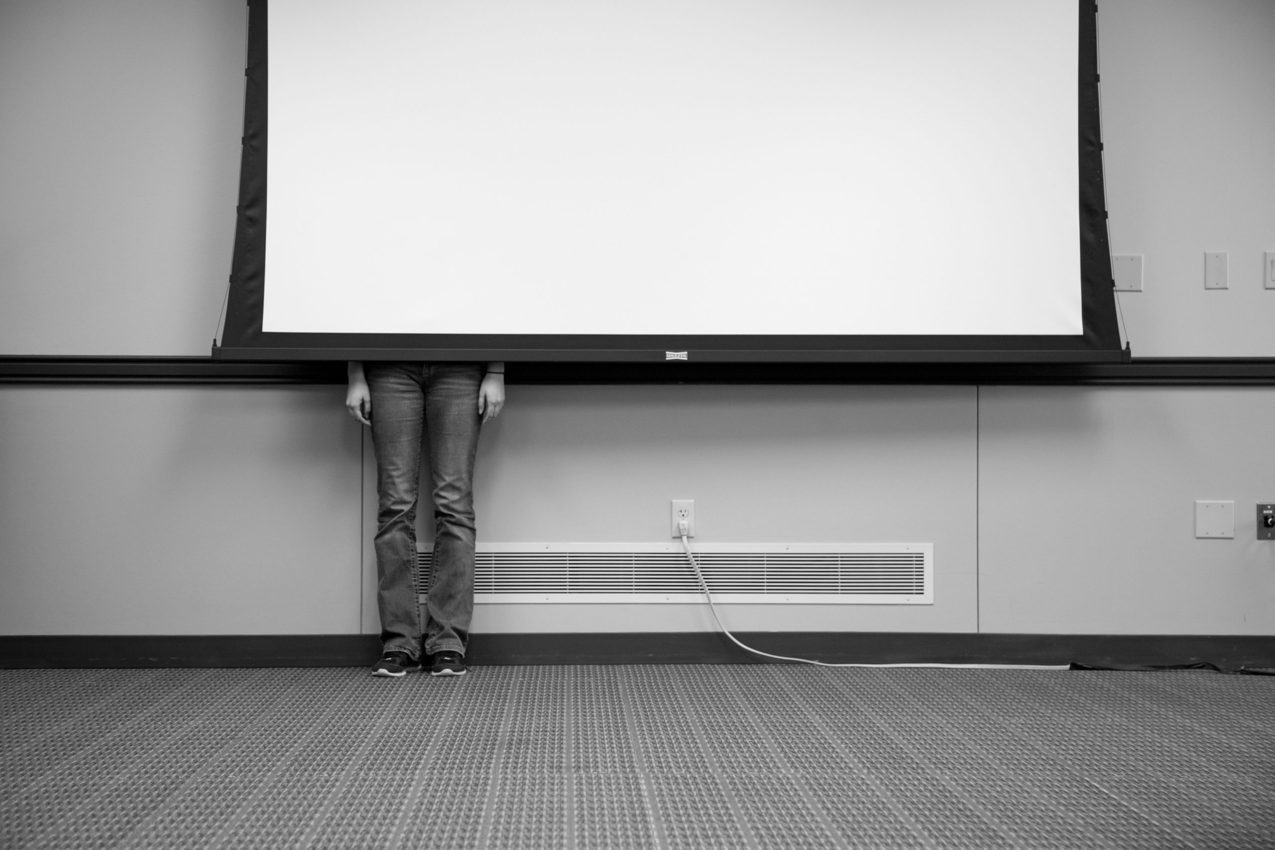 actuary Person standing behind a pull-down screen so that only the person’s legs and hands are visible Person standing behind a pull-down screen so that only the person's legs and hands are visible