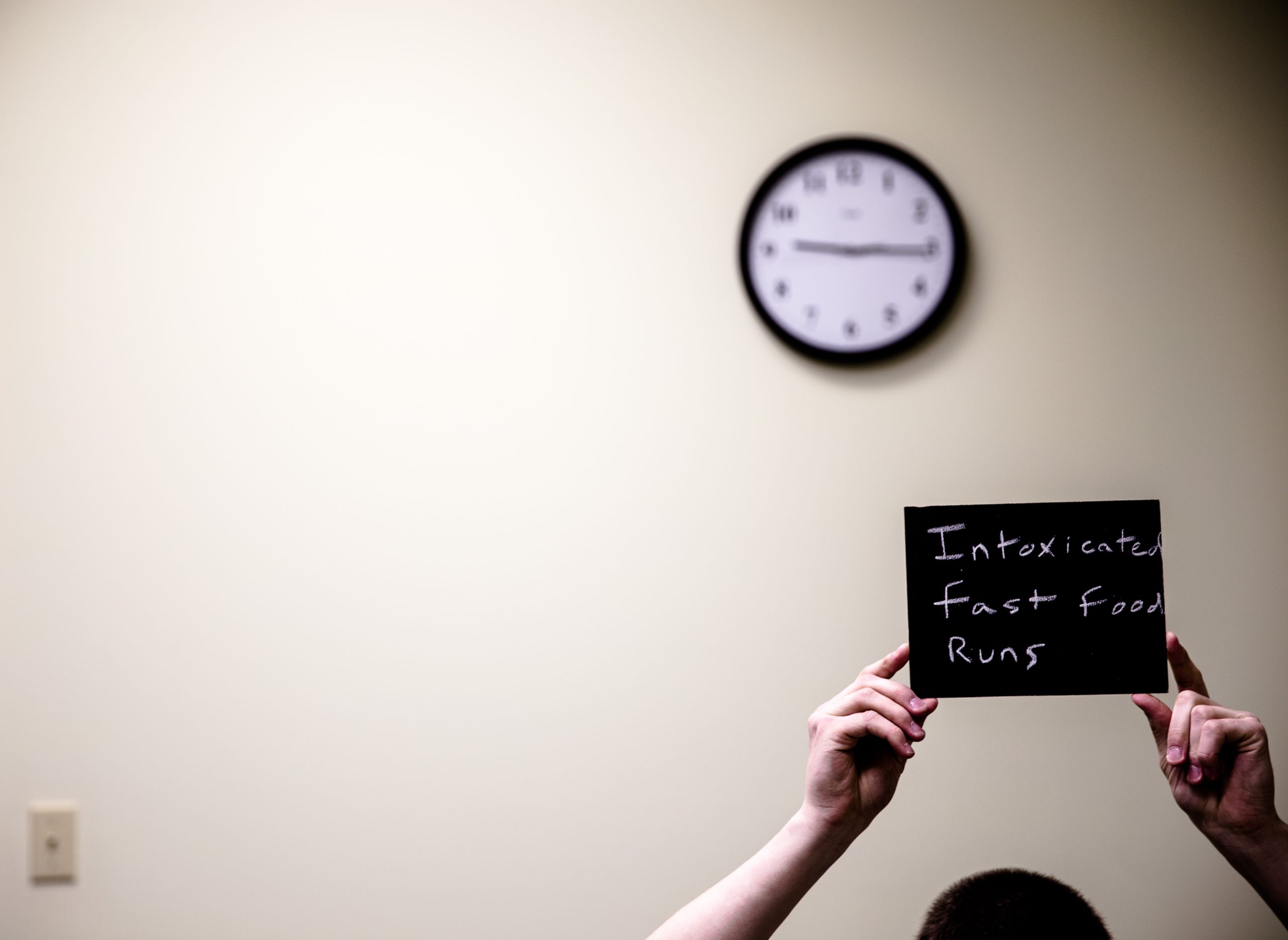 Chalkboard stating Intoxicated fast food runs written in chalk