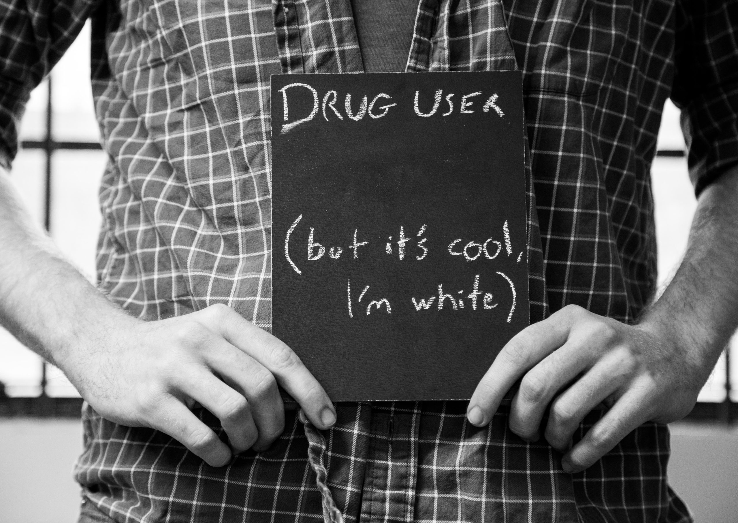 Chalkboard stating Drug User (but it's cool, I'm white) written in chalk