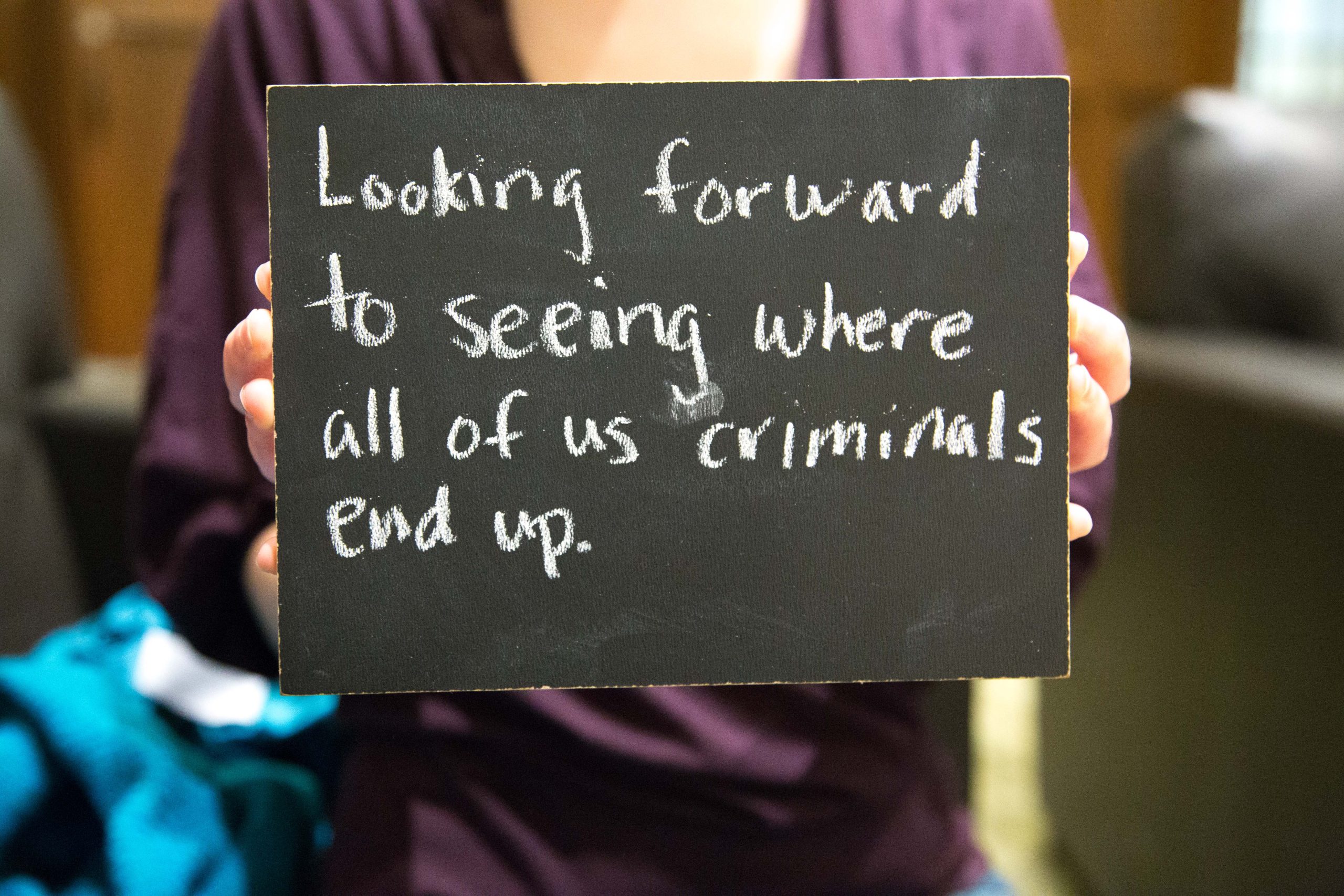 Chalkboard stating Looking forward to seeing where all of us criminals end up written in chalk