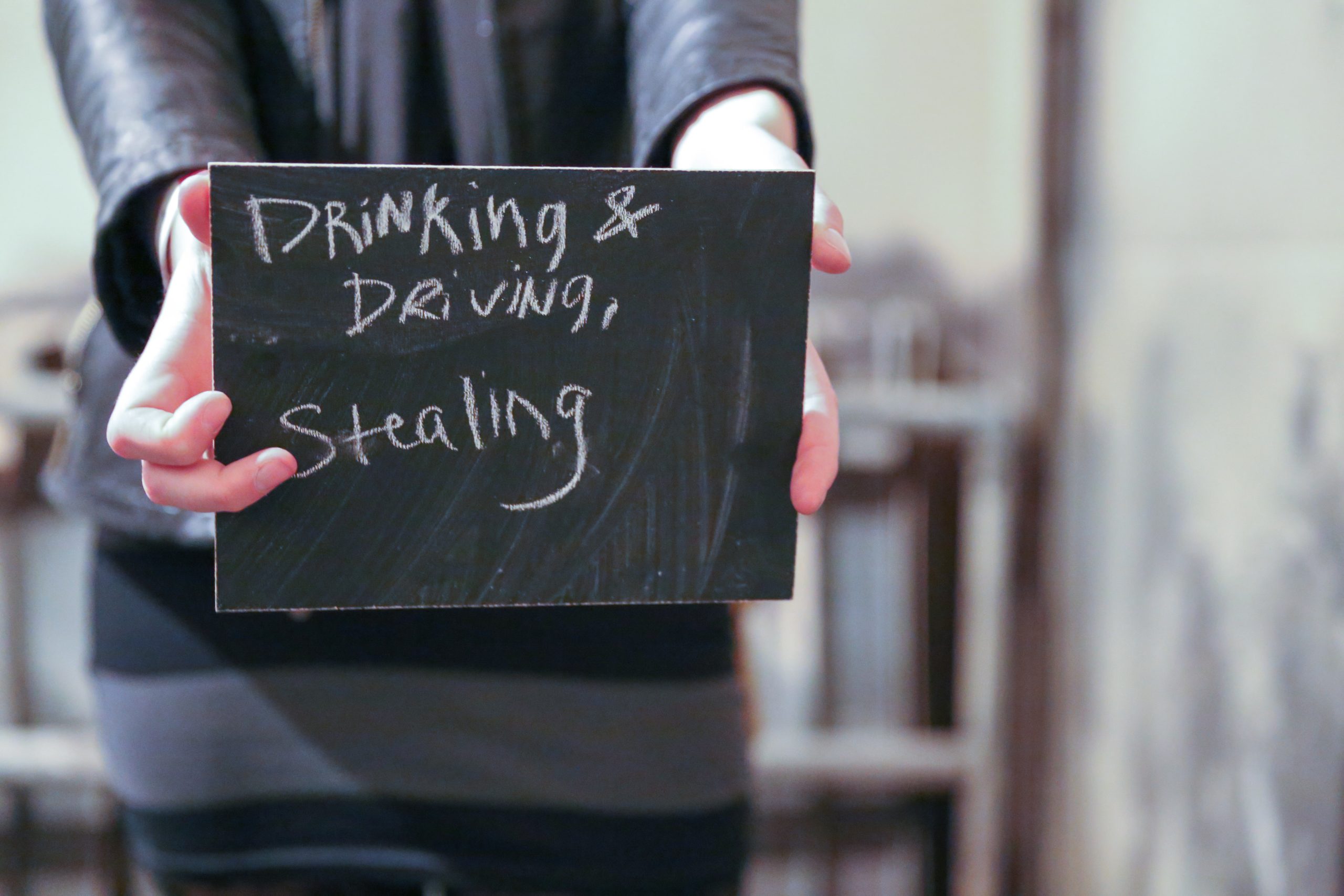 Chalkboard stating Theft from kids written in chalk