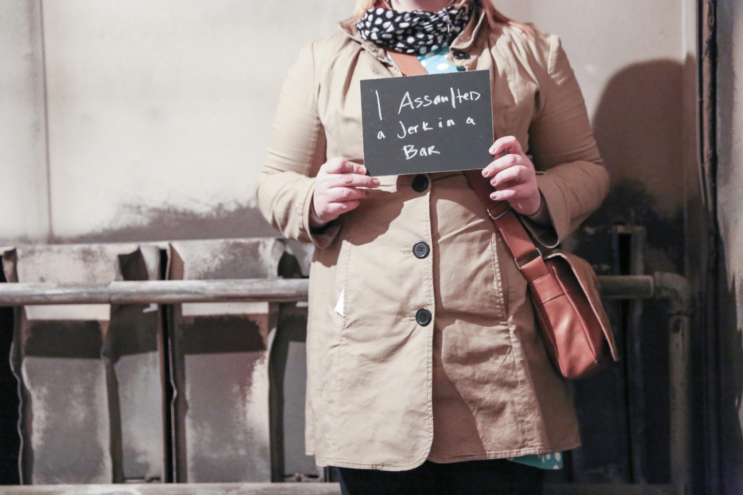 Chalkboard stating I assaulted a jerk in a bar written in chalk