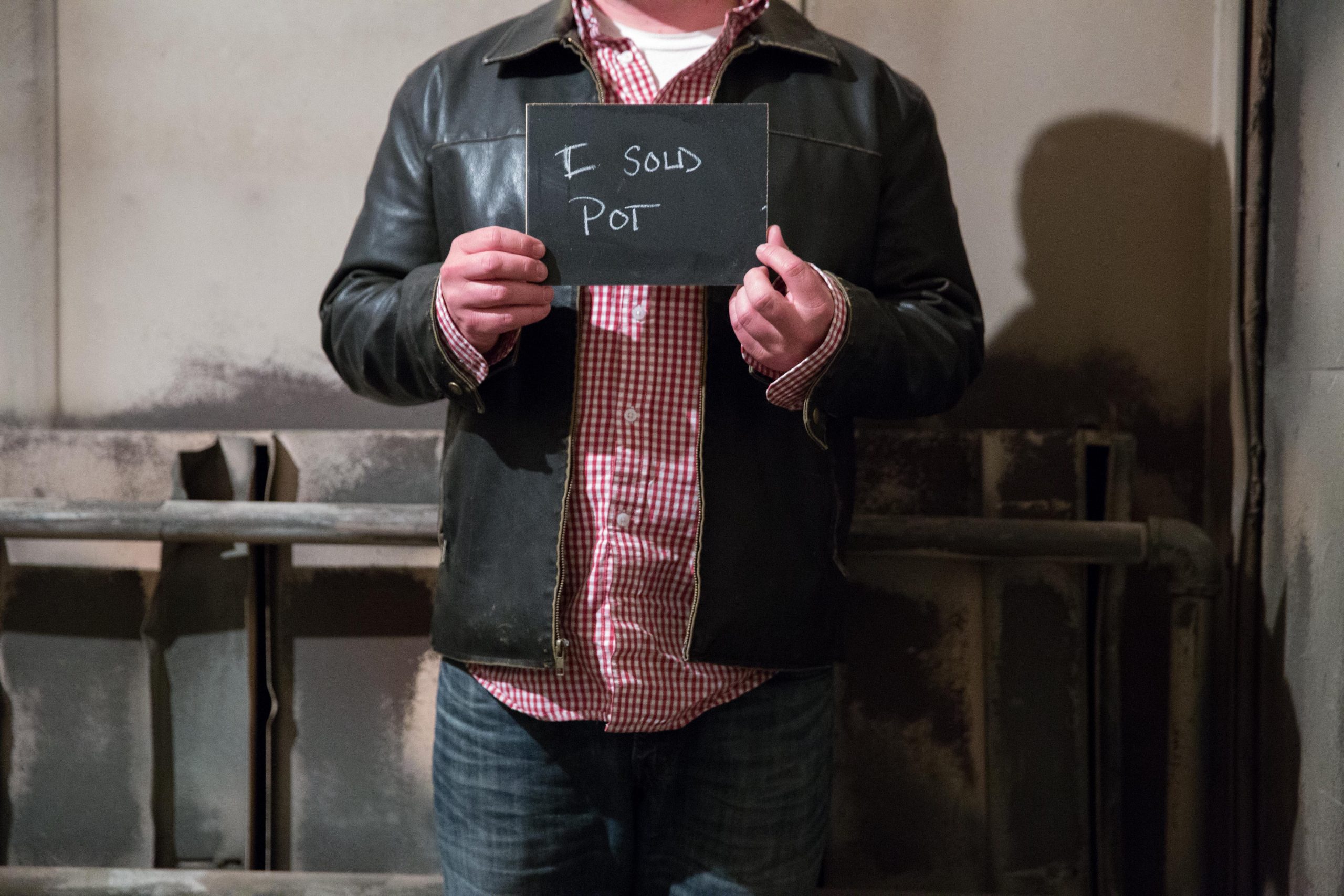 Chalkboard stating I sold pot written in chalk