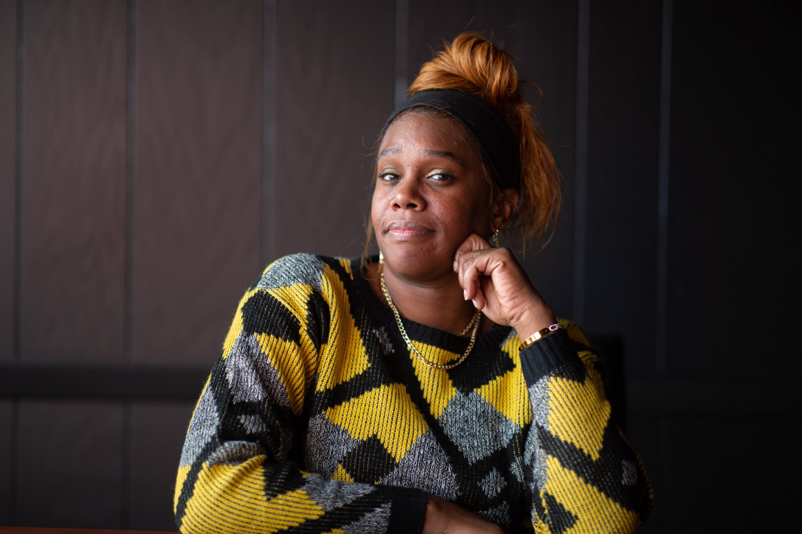 Mother and son in embrace, facing away from the camera