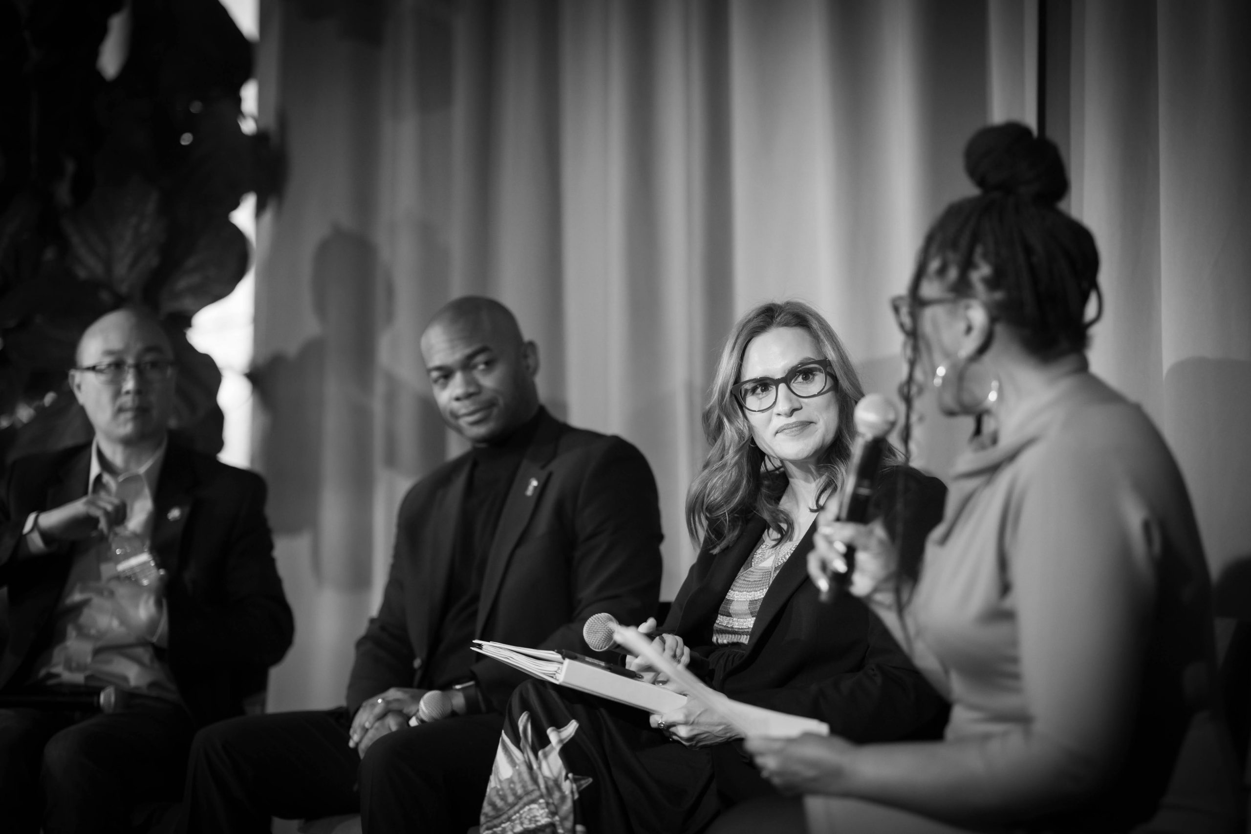 Lt Gov Peggy Flanagan on stage with Cedric Frazier and John Choi, being interviewed by Angela Davis