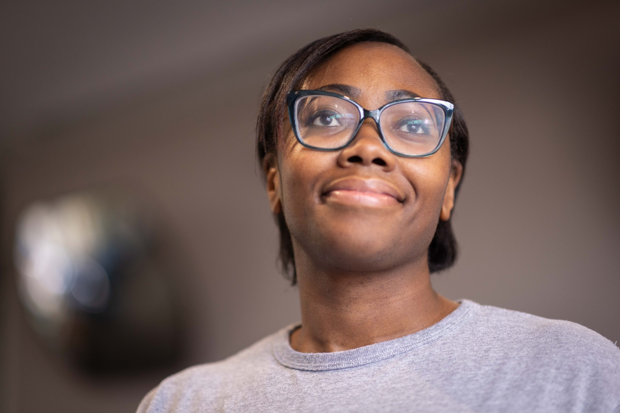Mother and son in embrace, facing away from the camera