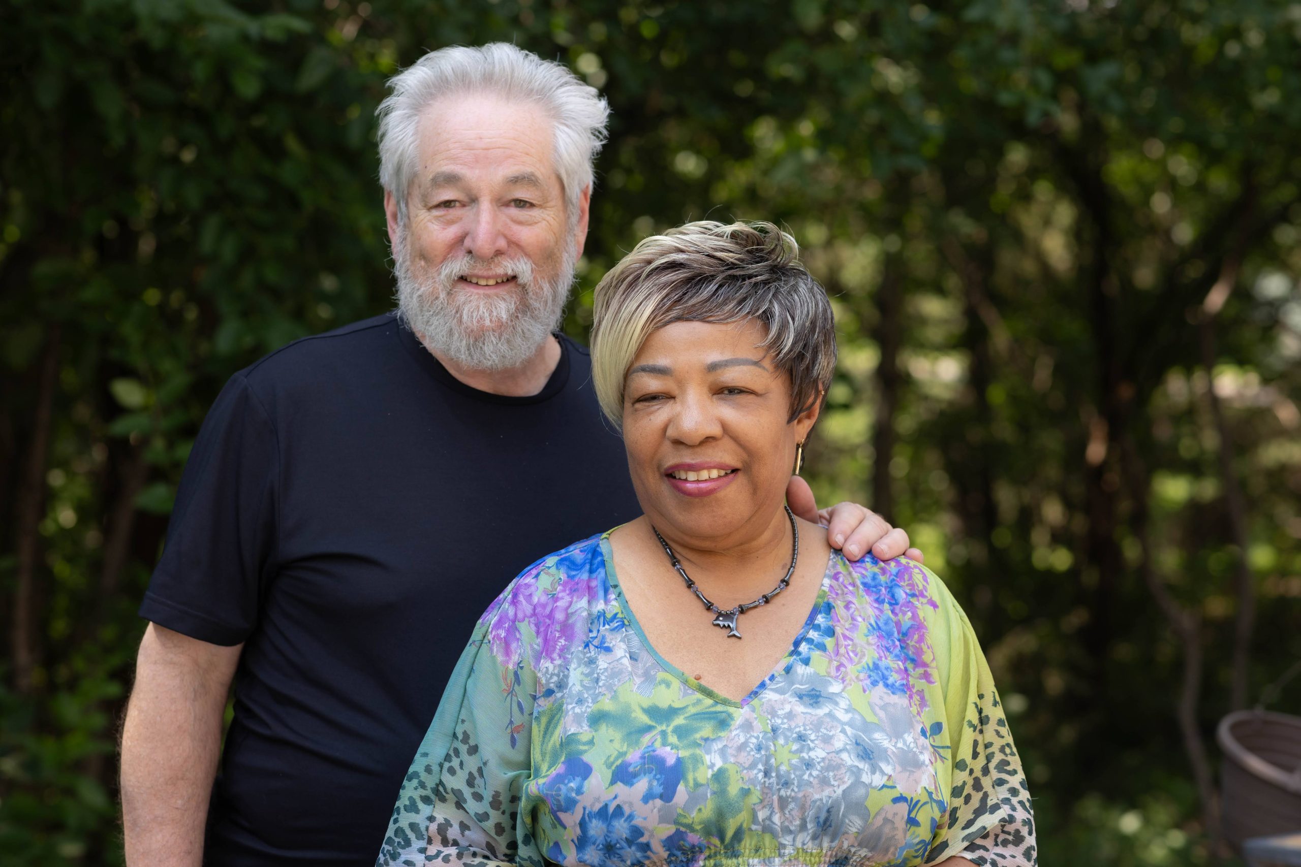 Nurse Sybil and Husband Mike posing in their garden