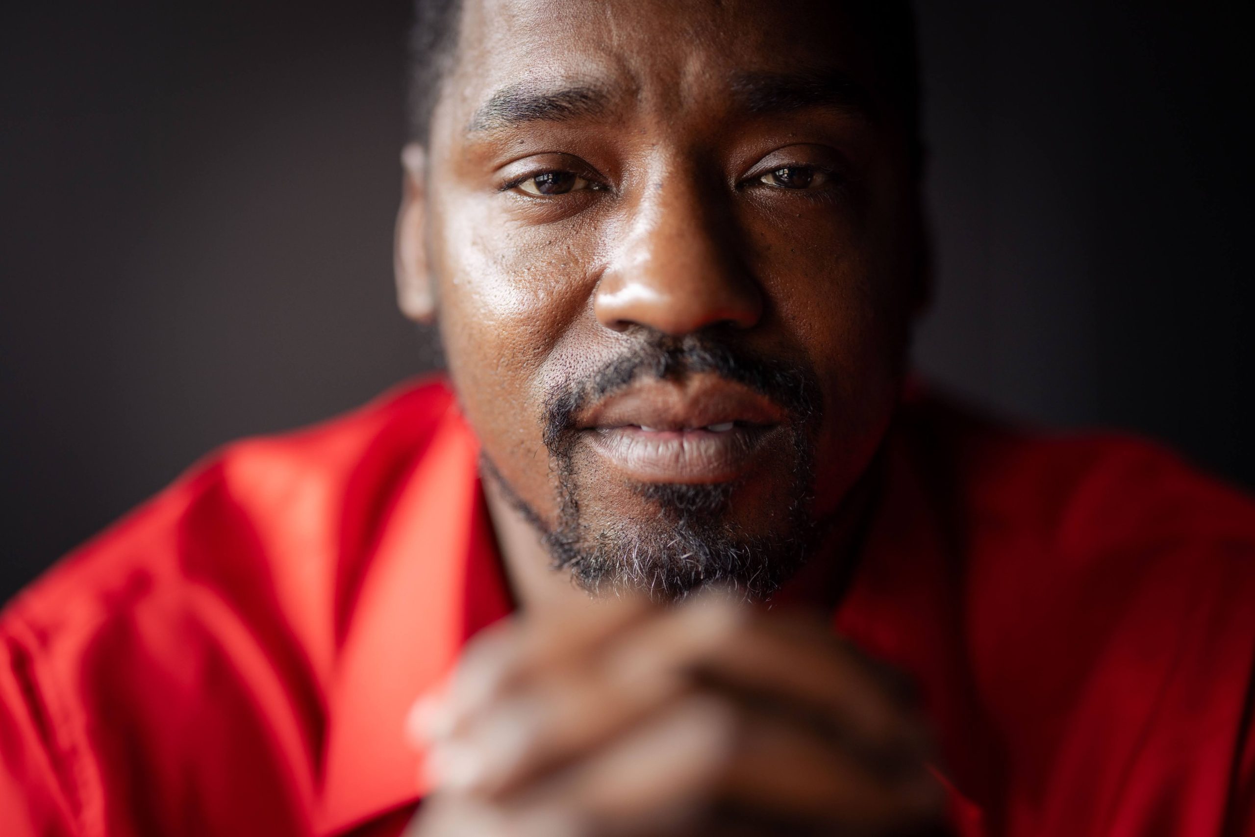 Small child climbing a rock wall at a camp